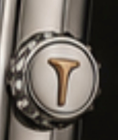 Mulligan signed crown with gold tee emblem, close-up